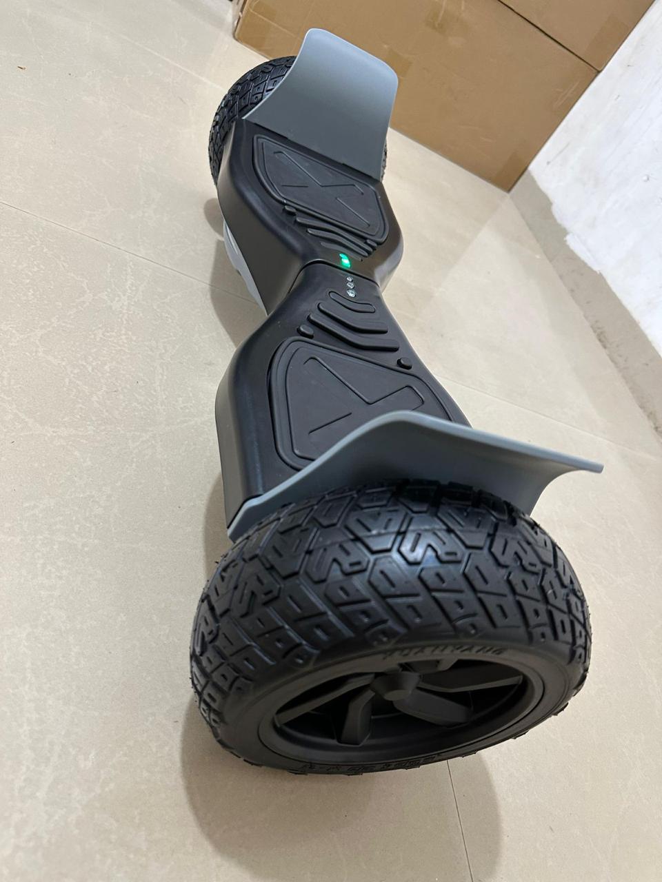 Black hoverboard with rugged tires, angled view, ideal for outdoor fun, hoverboards hoverboard in Ahmedabad Gujarat