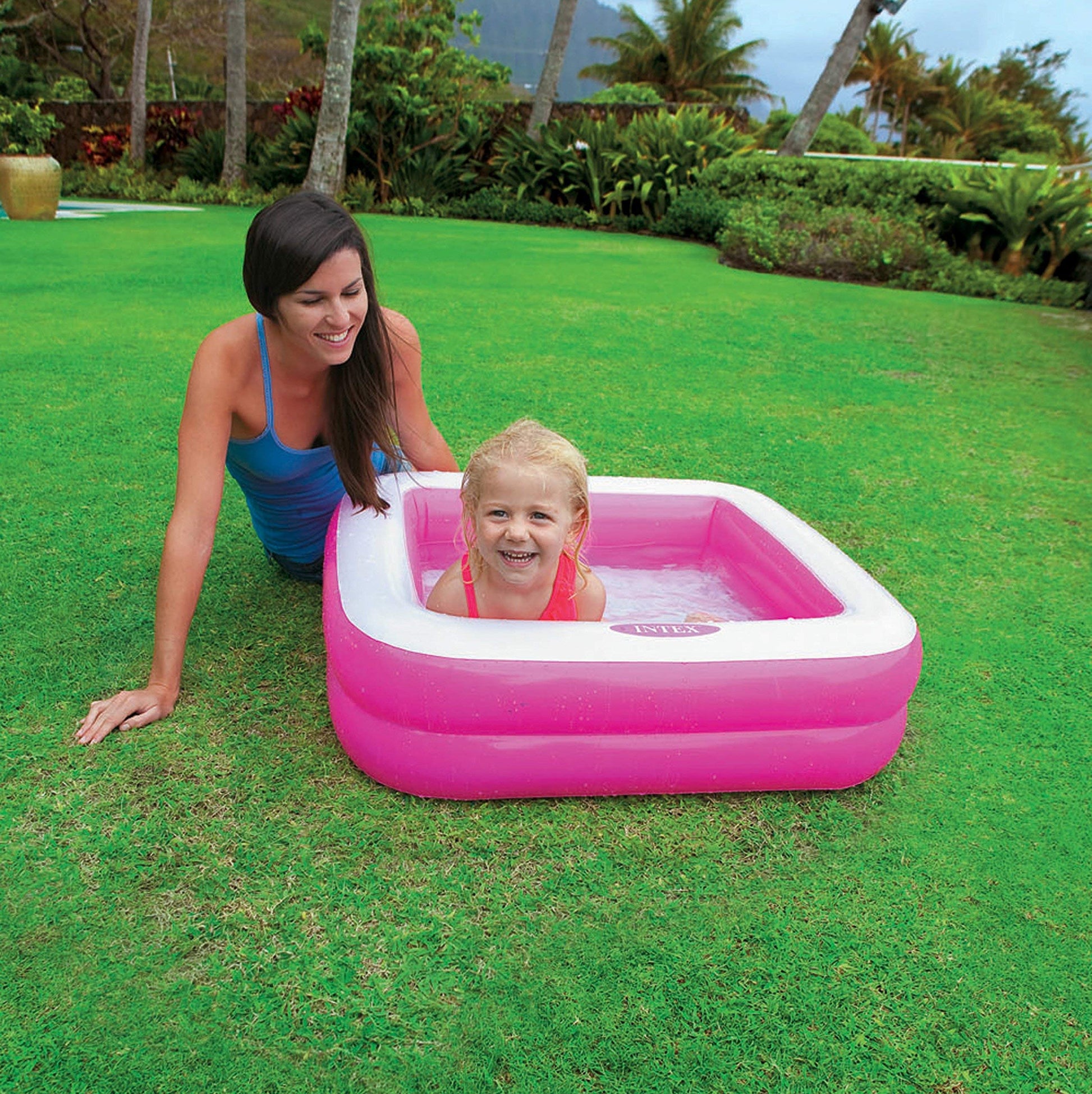 Intex portable inflatable swimming pool Ahmedabad with a smiling child enjoying in the garden