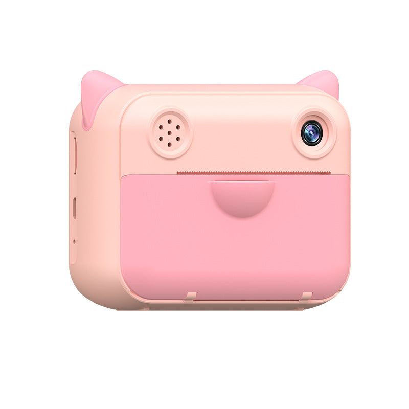 Pink kids camera with printer, side view, for capturing and printing fun memories