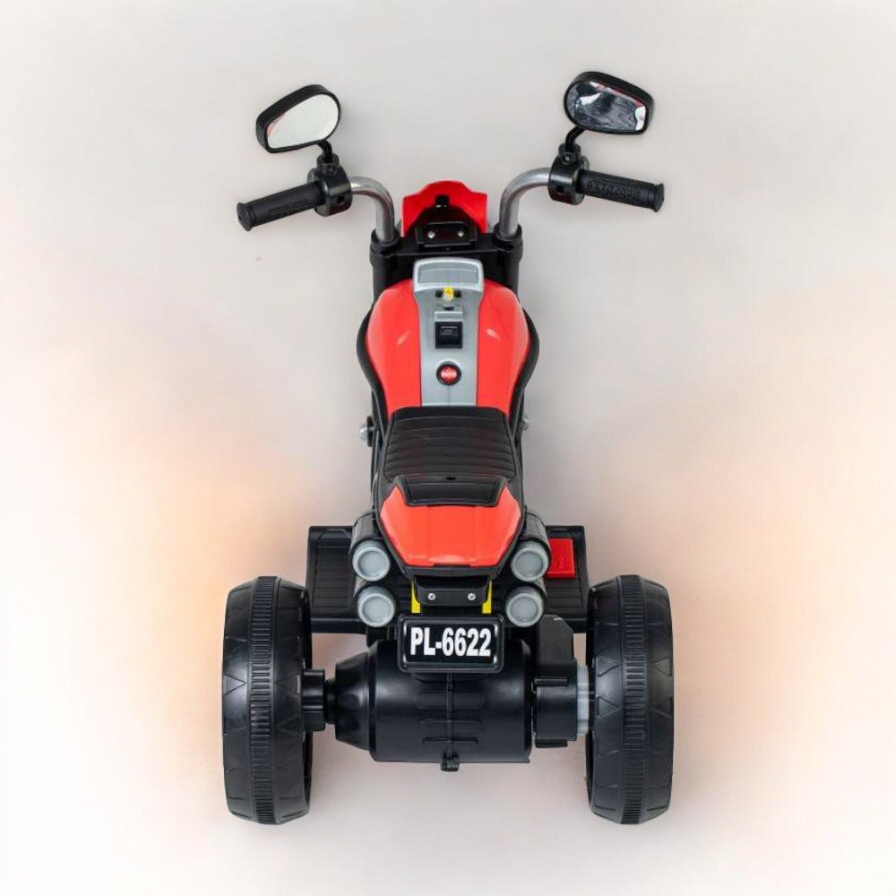 Red kids three wheel bike with foot accelerator in Gujarat with black seat and rearview mirrors