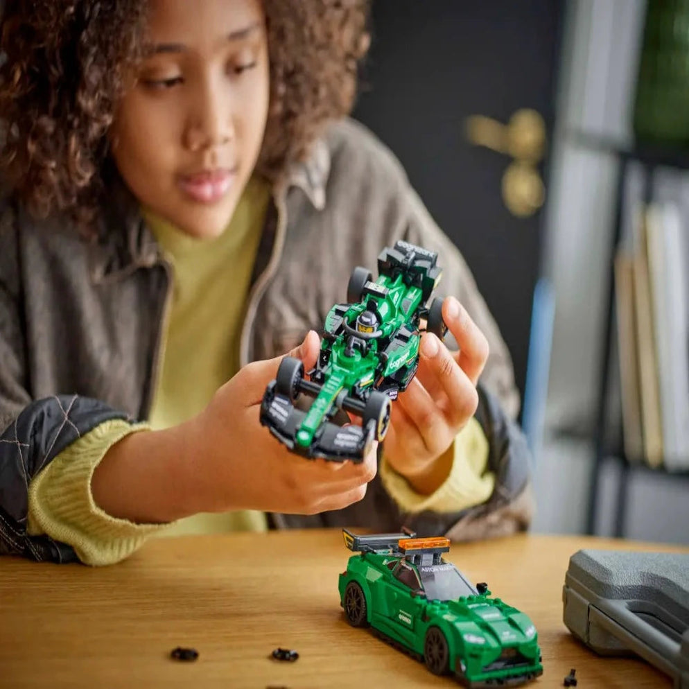 Child playing with green LEGO Aston Martin safety car and AMR23 set Buy Aston Martin Safety Car & AMR23 Lego India