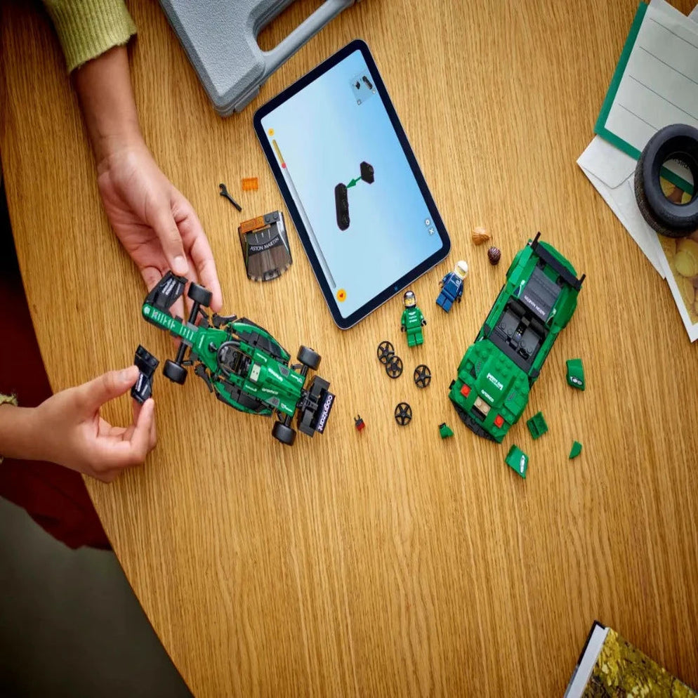 Hands assembling LEGO Aston Martin race and AMR23 car with tablet instructions Buy Aston Martin Safety Car & AMR23 Lego India