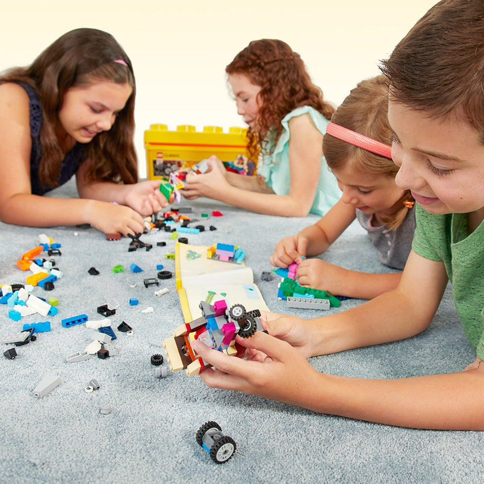 Kids building with multicolor bricks and yellow tub LEGO Classic Creative Brick Box 10696 Ahmedabad Gujarat online India .