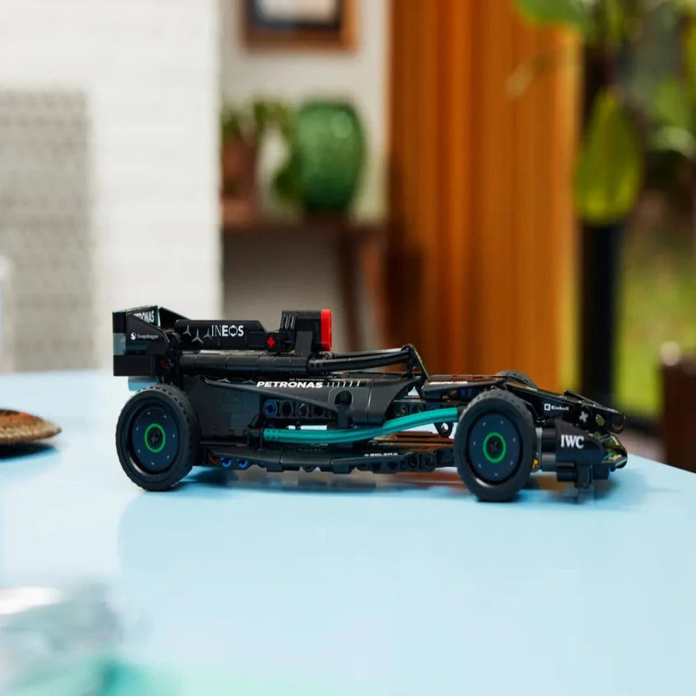 Lego Technic Mercedes F1 car India black and teal LEGO model on tabletop showcasing detailed chassis and wheels