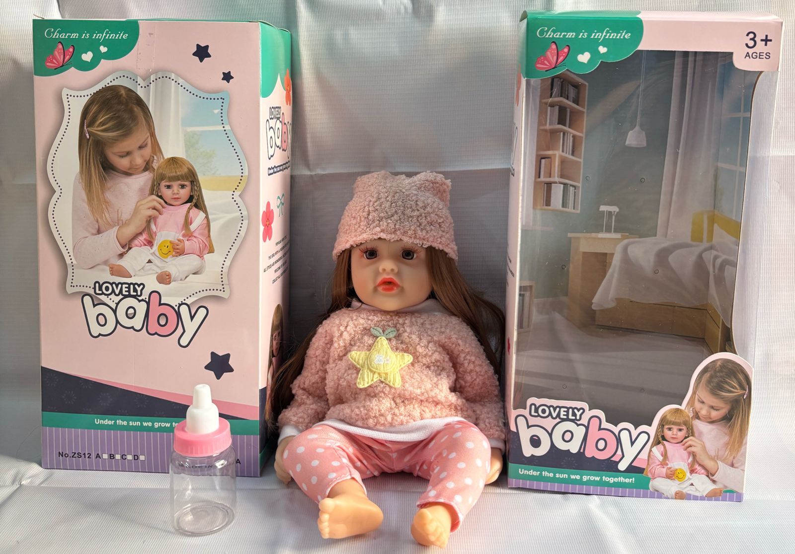 realistic baby doll with accessories silicone real Doll Ahmedabad . Pink outfit and bottle with box by samstoy.in