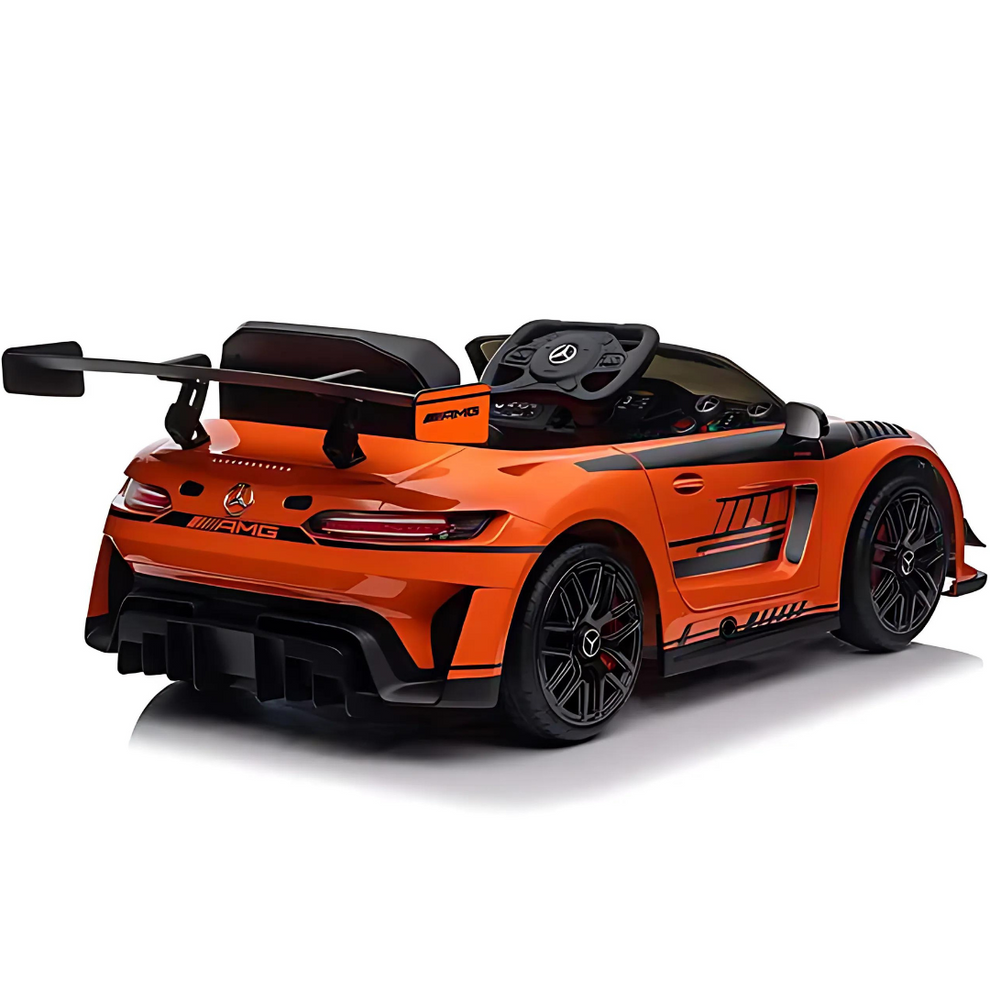 Orange Mercedes-AMG kids battery operated car, rear view, designed for fun outdoor rides