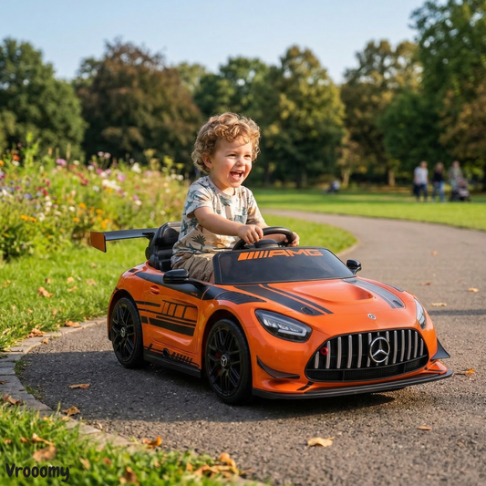 Orange Mercedes-AMG kids battery operated car, front view, perfect for outdoor play and fun rides