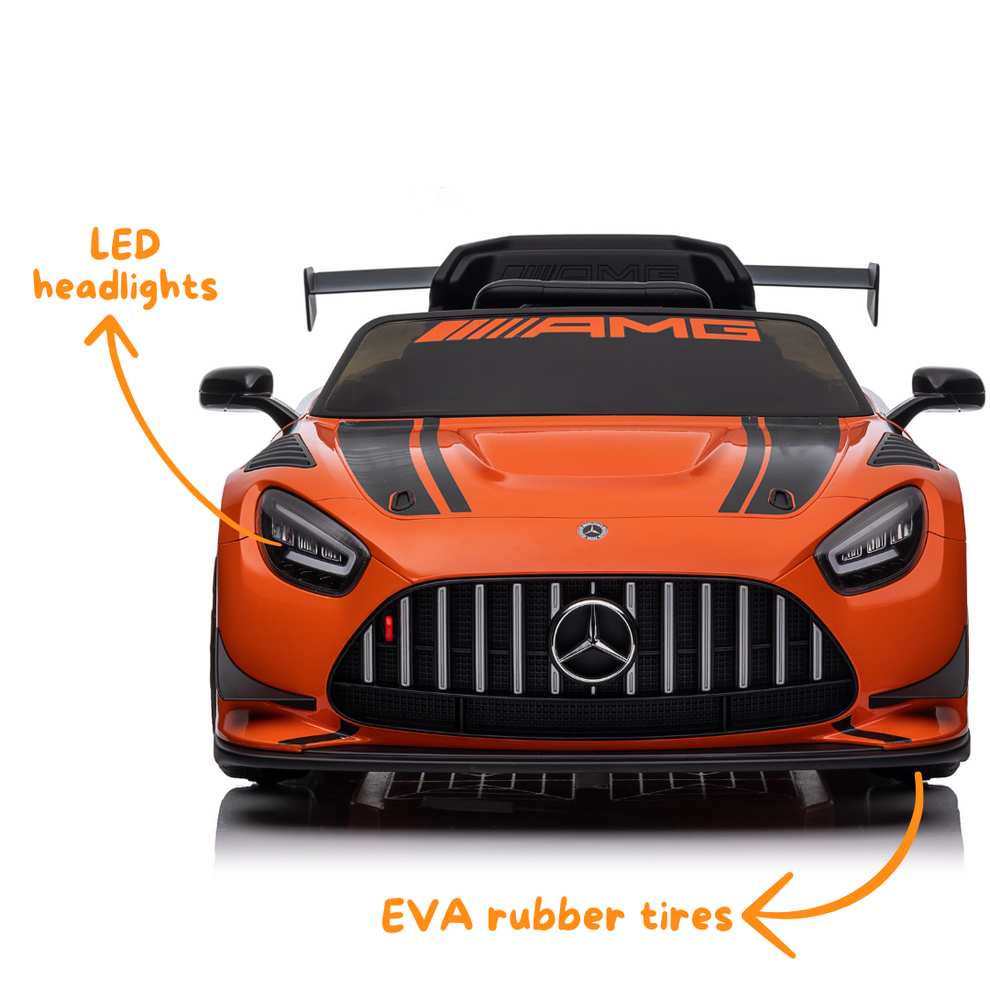 Orange Mercedes-AMG kids battery operated car with LED headlights and EVA rubber tires, front view, for young drivers