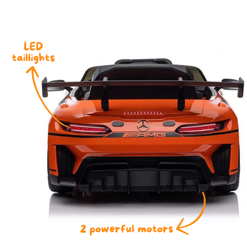 Orange Mercedes-AMG kids battery operated car with LED taillights and two powerful motors, rear view