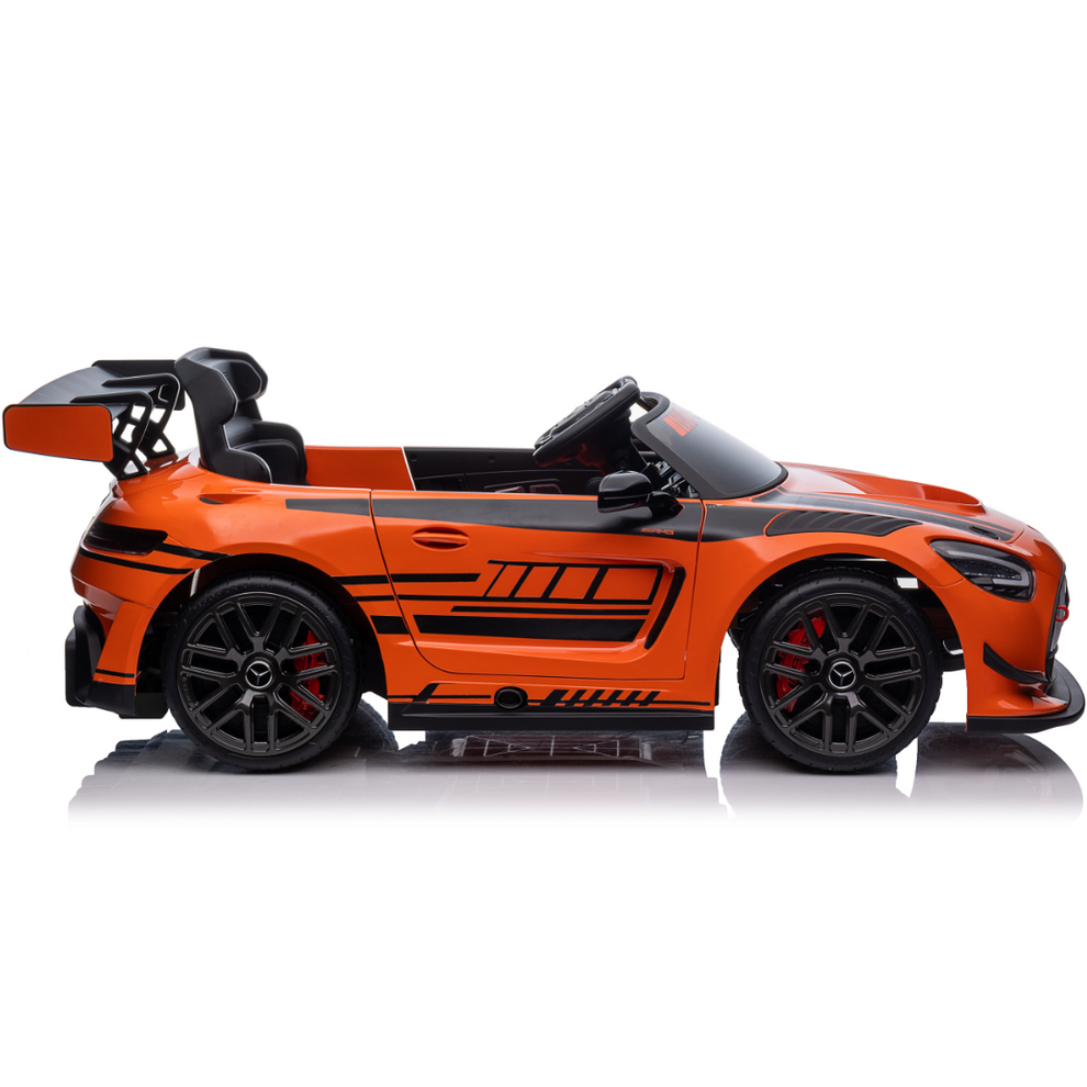 Orange Mercedes-AMG kids battery operated car, side view, for outdoor fun and imaginative play