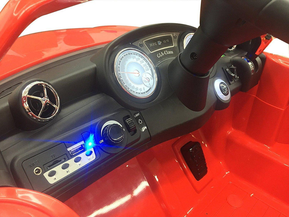 Close-up dashboard of red Mercedes Benz battery operated car for kids in Ahmedabad Gujarat with control panel and steering wheel