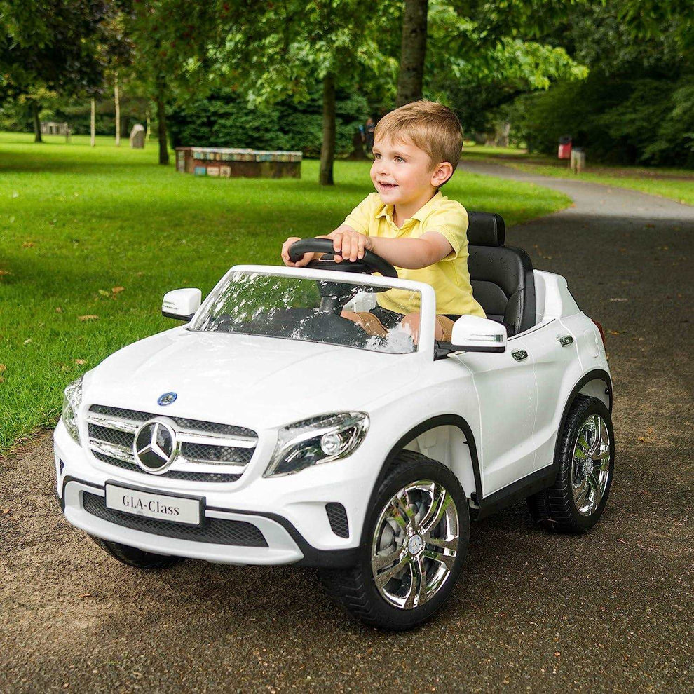 Mercedes Benz battery operated car for kids in Ahmedabad Gujarat with a child driving a white toy car outdoors