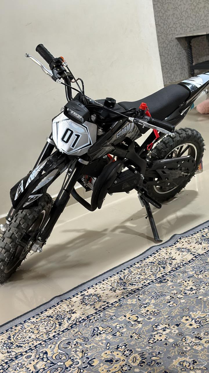 Black Moto dirt bike dirt bike 50cc petrol bike for kids in Ahmedabad, side view, perfect for outdoor adventures