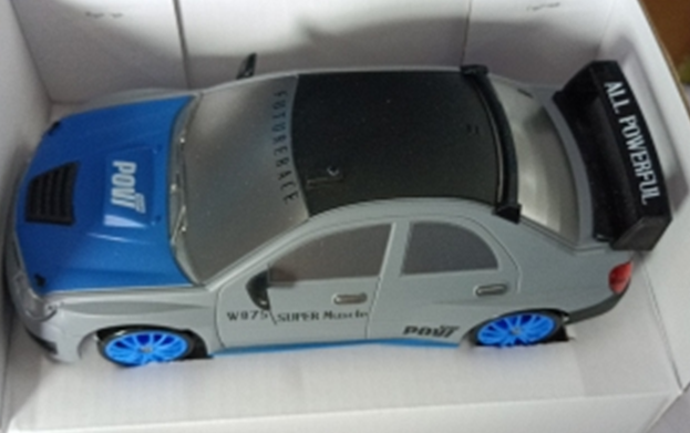 Gray and blue remote control car with remote, top view, for kids' outdoor playtime fun