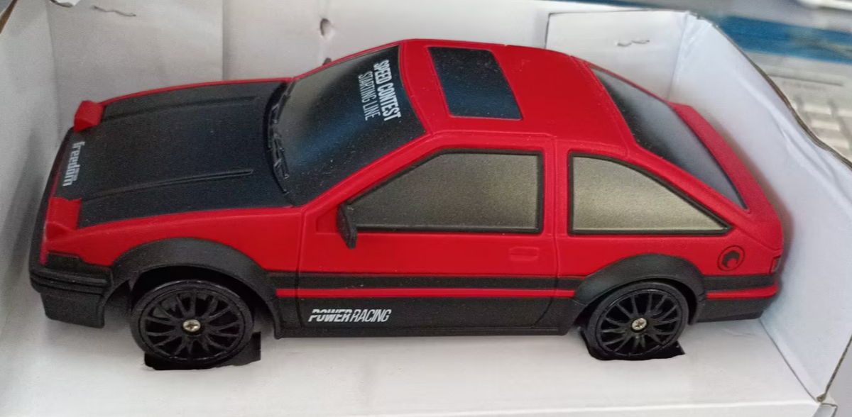 Red remote control car with remote, top view, perfect for indoor racing and playtime fun