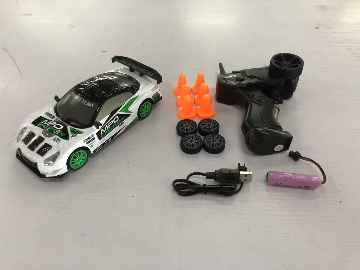 White and green remote control car with remote, accessories, for racing fun indoors and outdoors