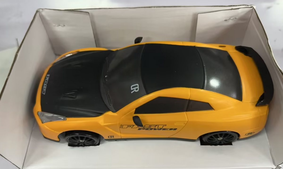 Yellow remote control car with remote, top view, perfect for kids and outdoor play