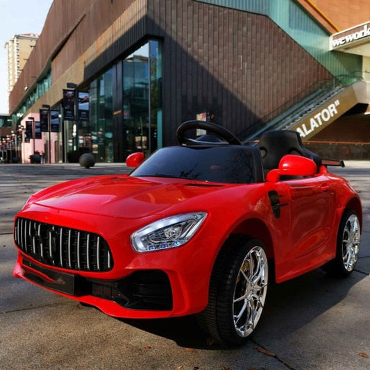 Red remote control kids car 1-8 years with realistic design and shiny chrome wheels for outdoor play