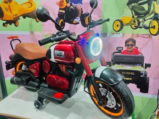 Red electric bike for kids with dual headlights and comfortable seat, front view for outdoor fun