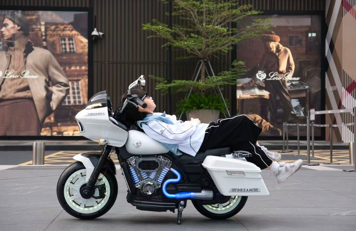 Jumbo size kids electric rechargeable ride on bike harley model at Sam's Toy Ahmedabad with white color and kid sitting