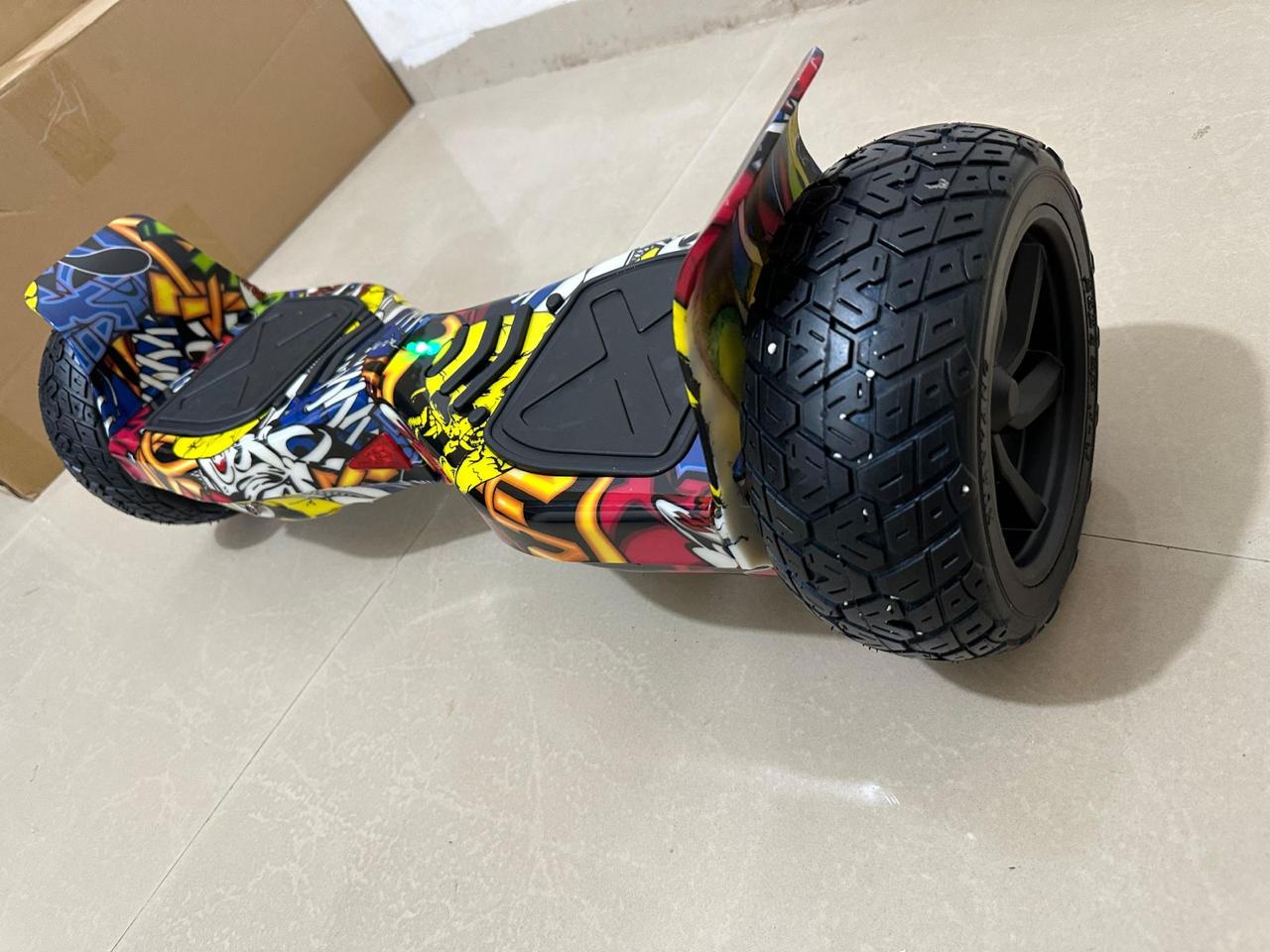 Colorful off-road hoverboard from Sam's Toy Ahmedabad Gujarat, side view, designed for adventurous outdoor play