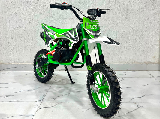 Green and white 49cc dirt bike in Ahmedabad by Sam's Toy World, ideal for young riders, side view