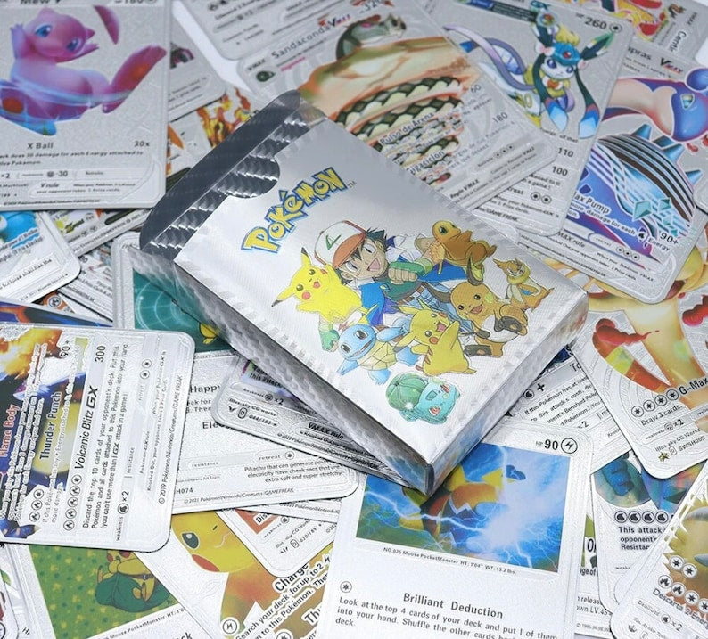 Silver Pokemon card pack with various cards of pokemon at Sam's Toy World Ahmedabad, ideal for collectors