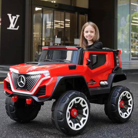 Red battery operated jeep for kids Make in Ahmedabad by Sam's Toy World with large wheels and a child rider