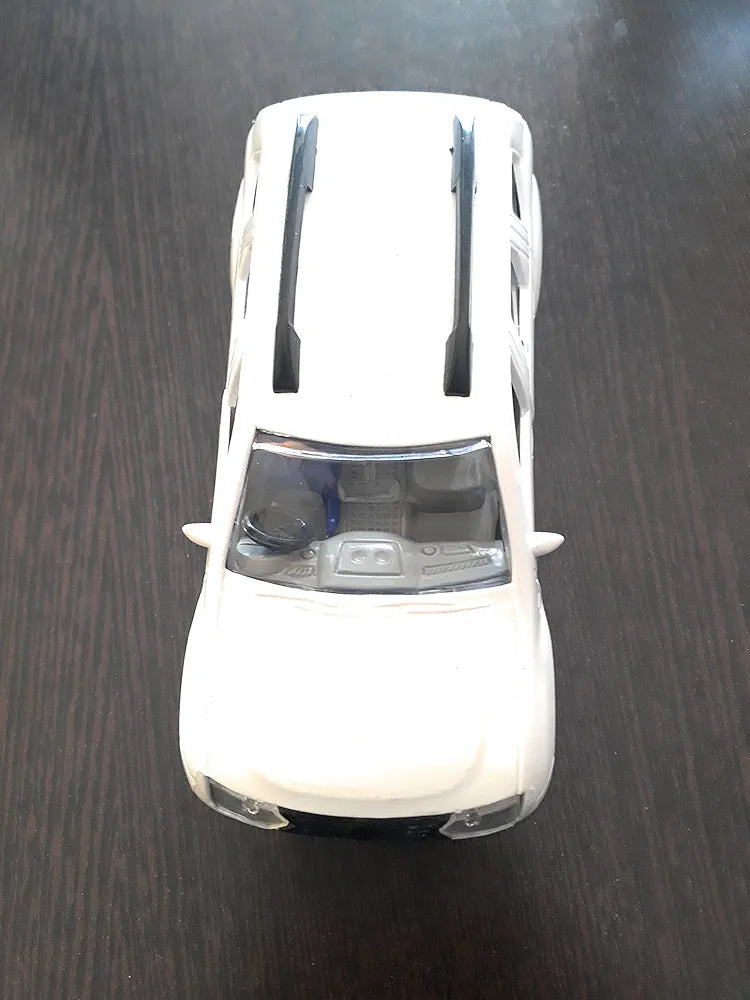 White diecast car top view with black roof rails and visible interior diecast vehicle toy showpiece Sam's Toy World Ahmedabad shop