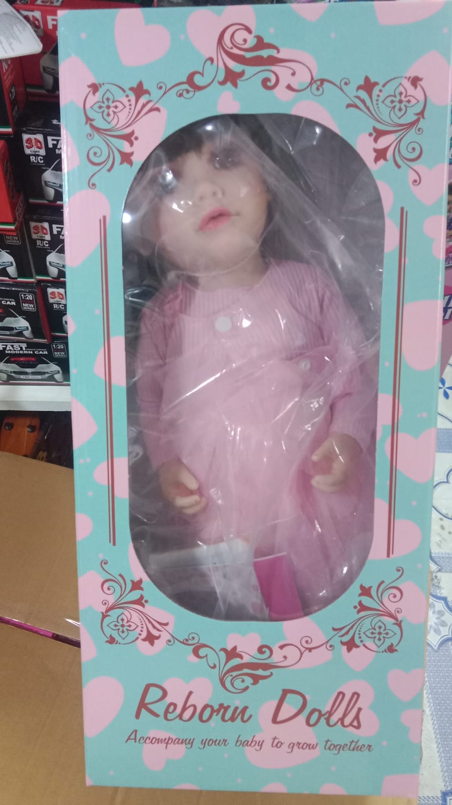 Reborn Dolls in Pink Dress for Ages 3+ by Sam's Toy World, featuring a lifelike Silicon Doll, Real Baby Doll, Ai Doll Toy in Ahmedabad