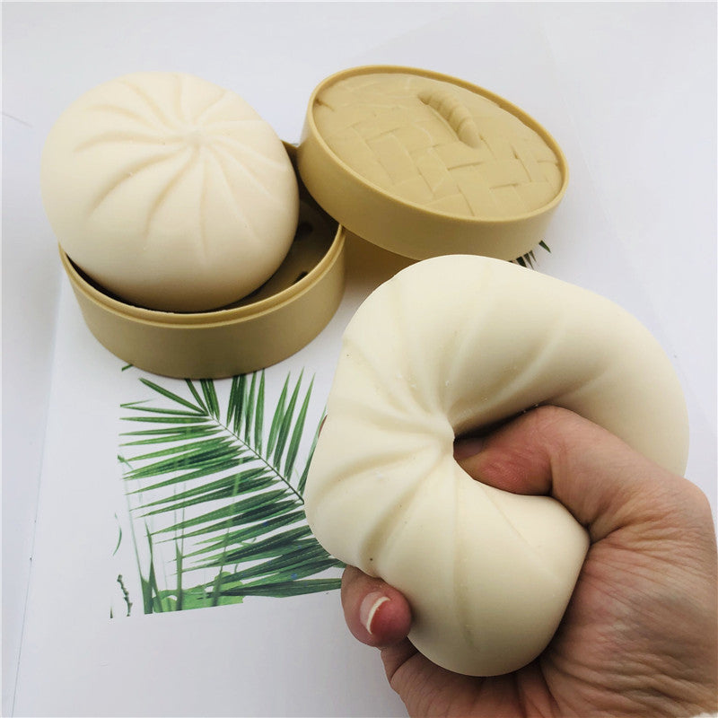 Soft squishy stress relief toy in white bun shape, side view, for stress relief management techniques