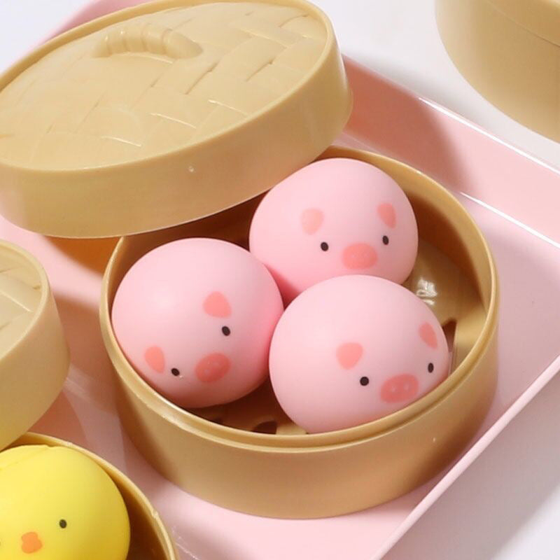 Colorful stress relief toy set with pink pig balls in a tan container for stress relief management techniques