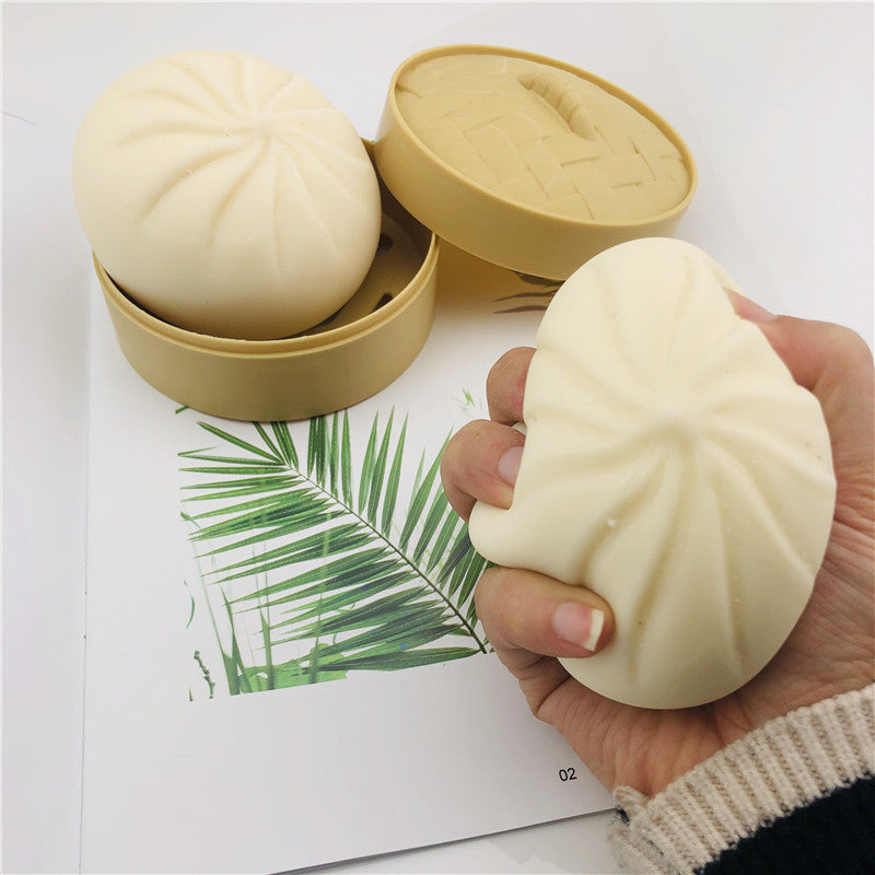 Cream-colored stress relief squishy toy in hand, designed for stress relief management techniques