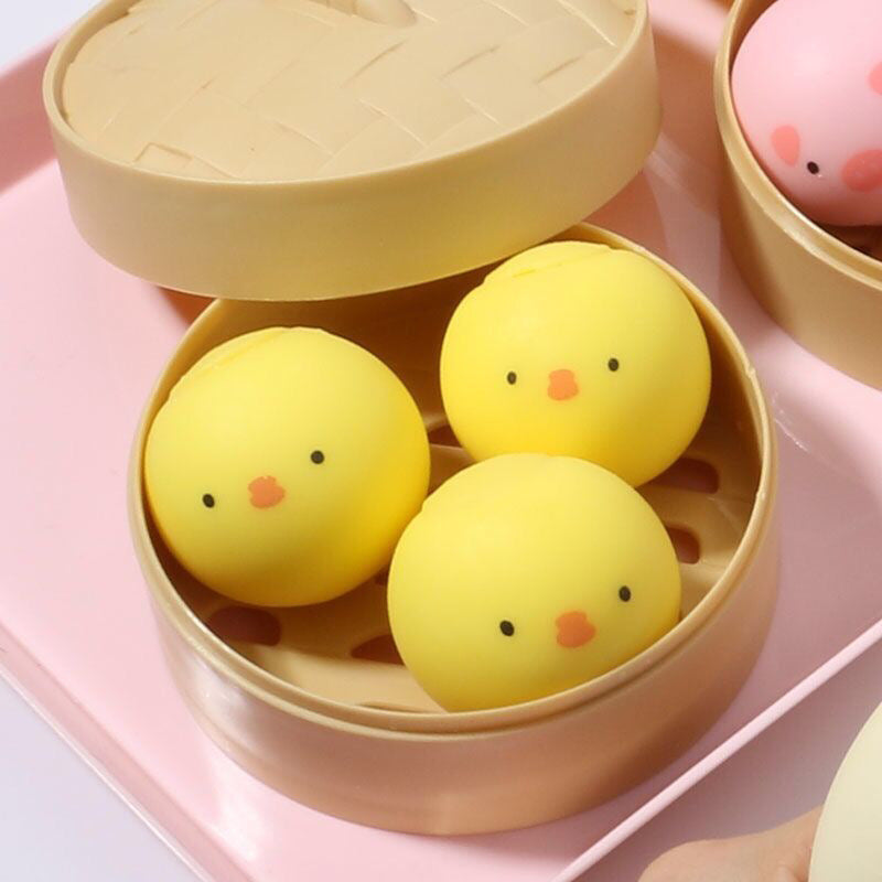 Cute yellow chick stress balls in a bamboo steamer, ideal for stress relief management techniques
