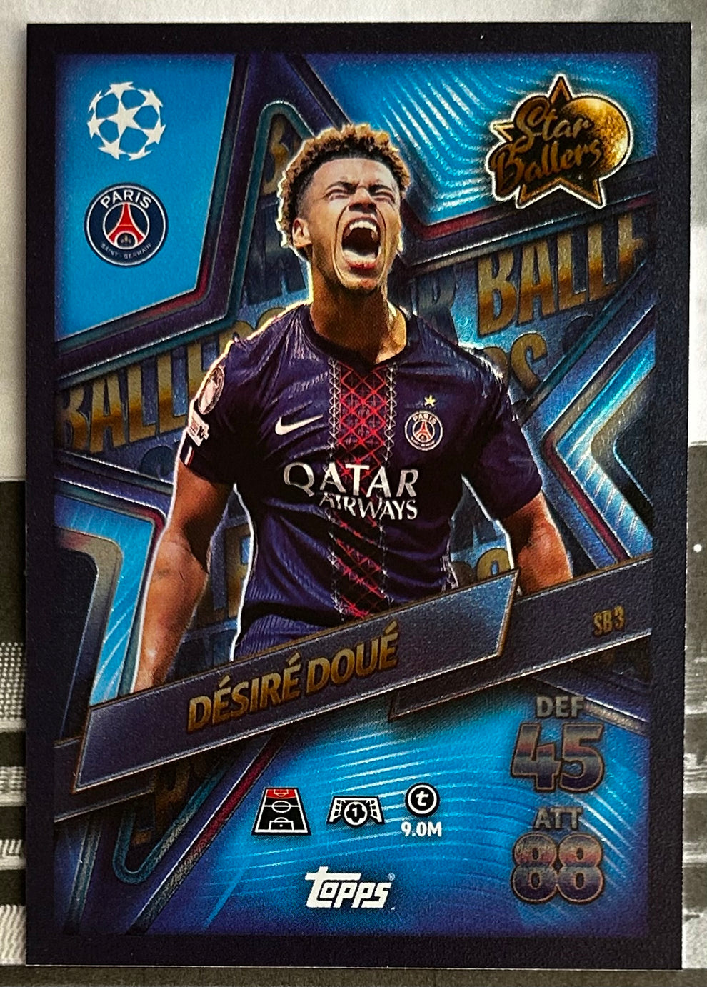 Topps Match Attax football trading card featuring Désiré Doué in Paris Saint-Germain jersey, showcasing player stats