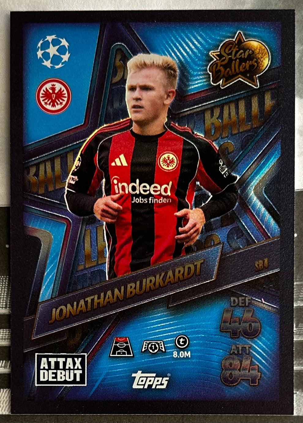 Topps Match Attax trading cards football featuring Jonathan Burkardt in a black and red jersey, front view for collectors