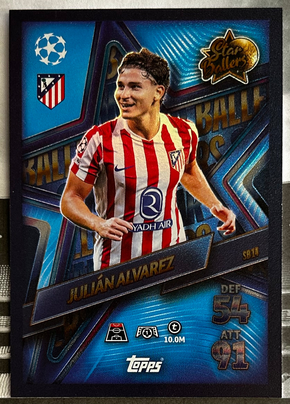 TOPPS Match Attax trading card featuring Julian Alvarez in Atletico Madrid jersey, showcasing stats and vibrant design