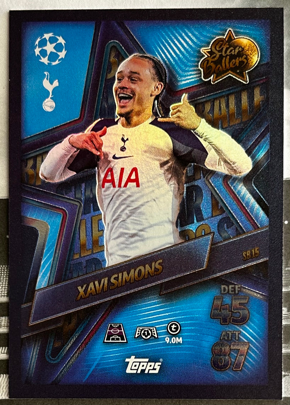 Topps Match Attax football trading card featuring Xavi Simons in a colorful design