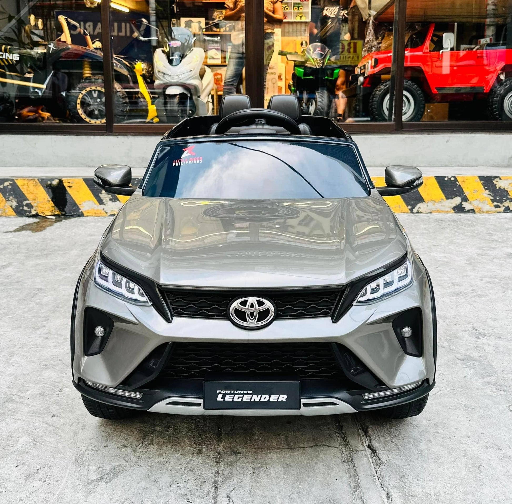 Gray Toyota Fortune licensed ride-on car for kids Ahmedabad, front view, perfect for outdoor fun