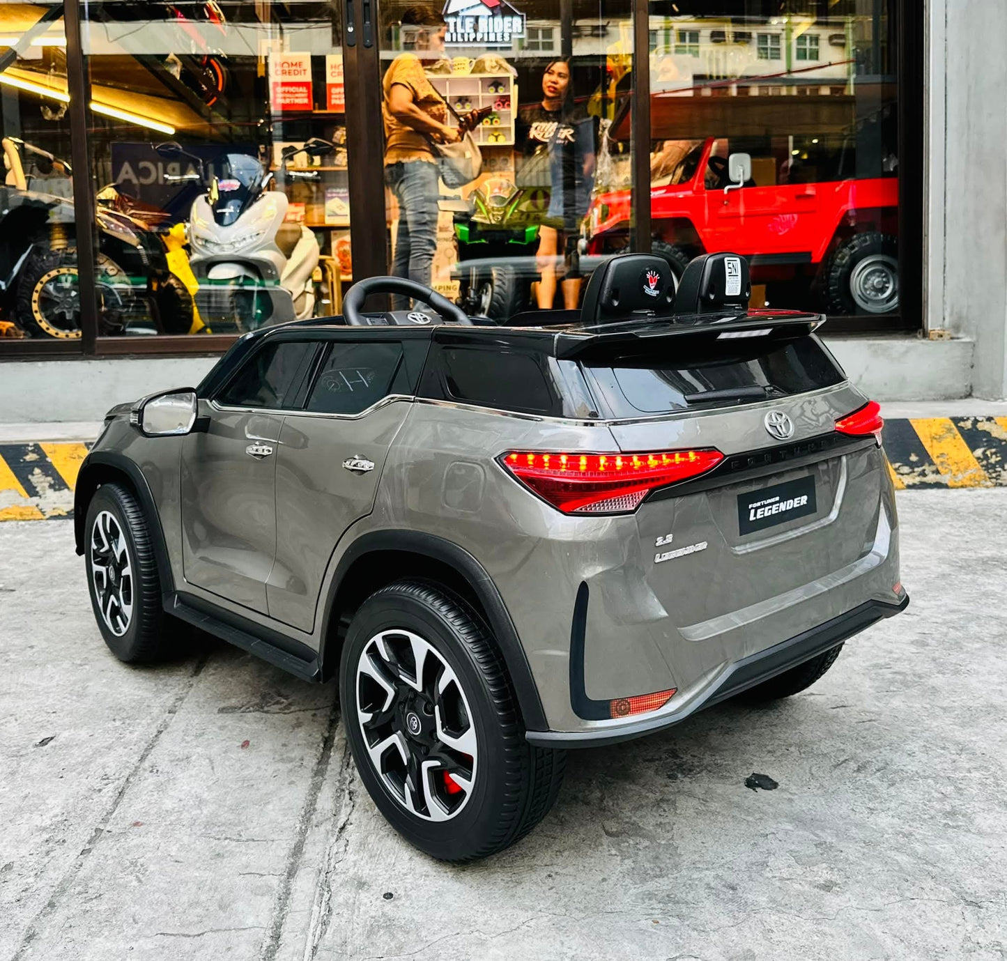 Gray Toyota Fortune licensed ride-on car for kids Ahmedabad, rear view, perfect for outdoor play